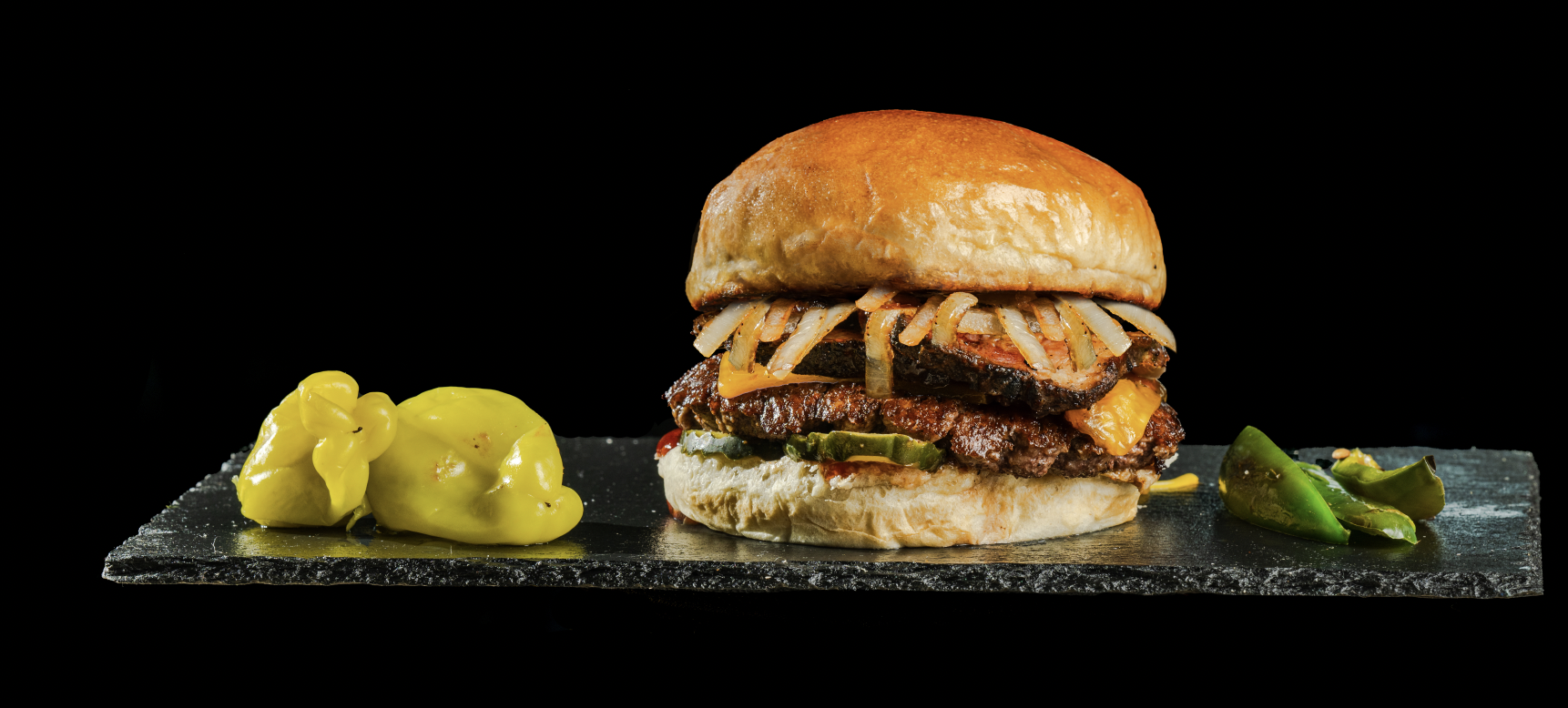 Burger Boss brisket burger campaign photography on black