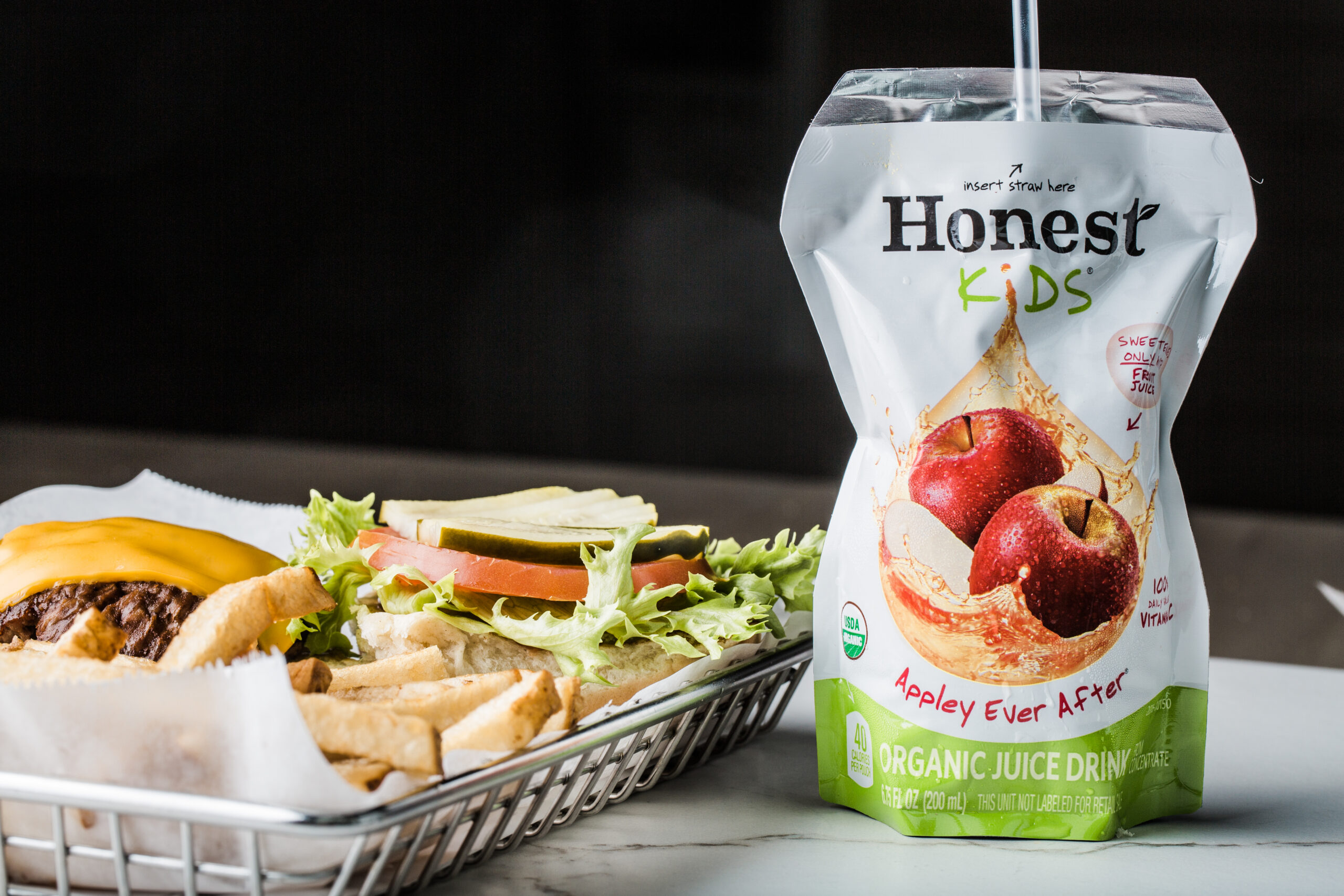 Honest Kids Appley Ever After drink photographed with a Burger Boss meal